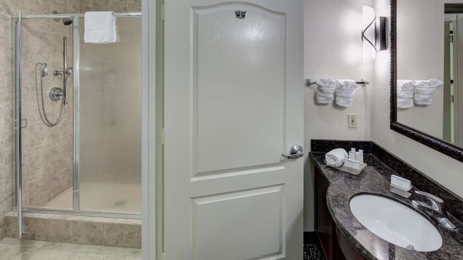 Private guest bathroom with shower and free toiletries at Homewood Suites By Hilton Agoura Hills.