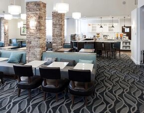 Dining area with comfortable seating perfect for coworking at Homewood Suites By Hilton San Jose Airport-Silicon Valley.