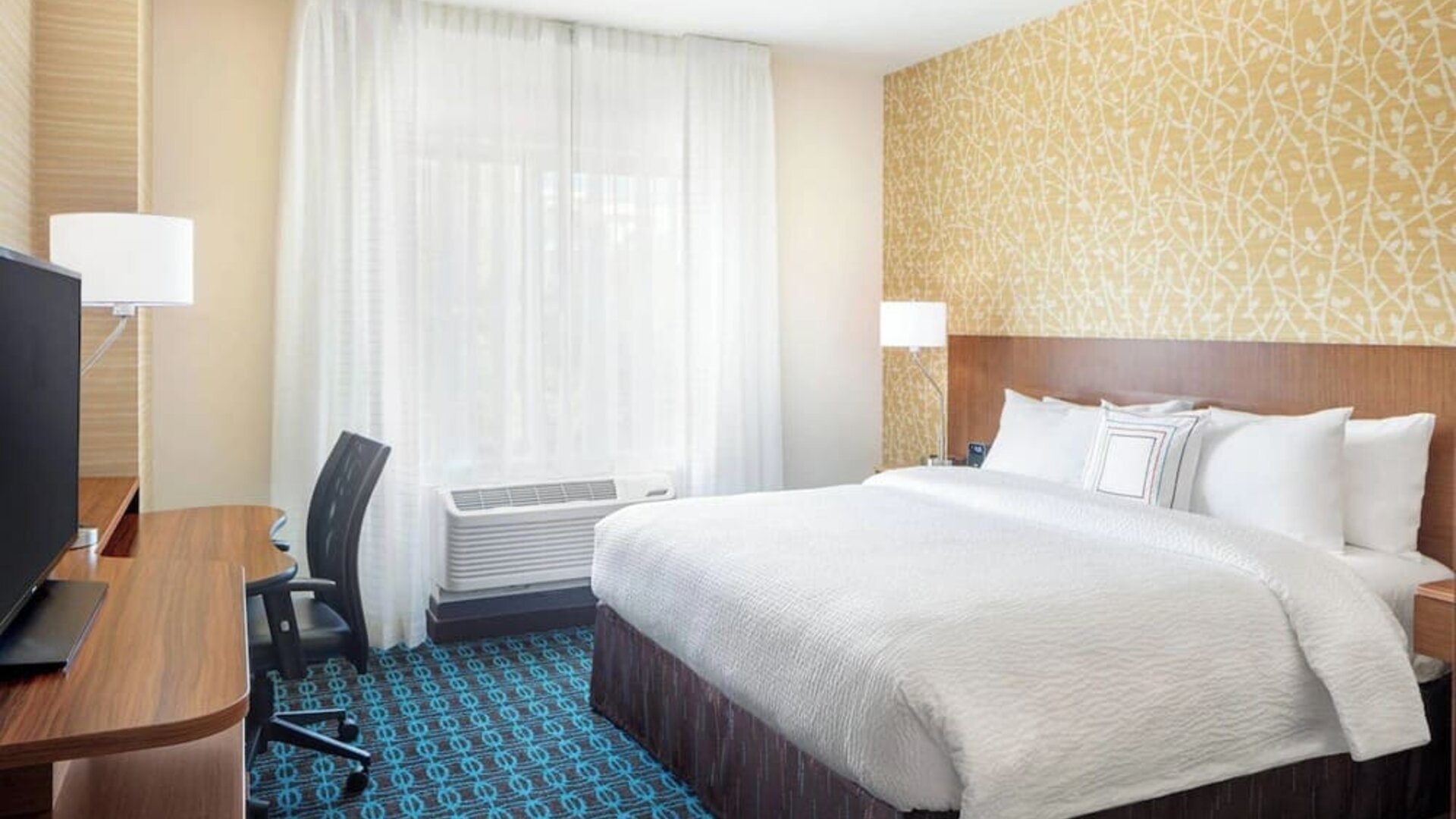 King room with work desk and TV at Fairfield Inn & Suites By Marriott North Bergen.