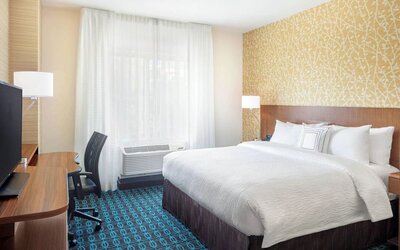 King room with work desk and TV at Fairfield Inn & Suites By Marriott North Bergen.