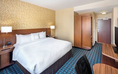King room with work desk and TV at Fairfield Inn & Suites By Marriott North Bergen.