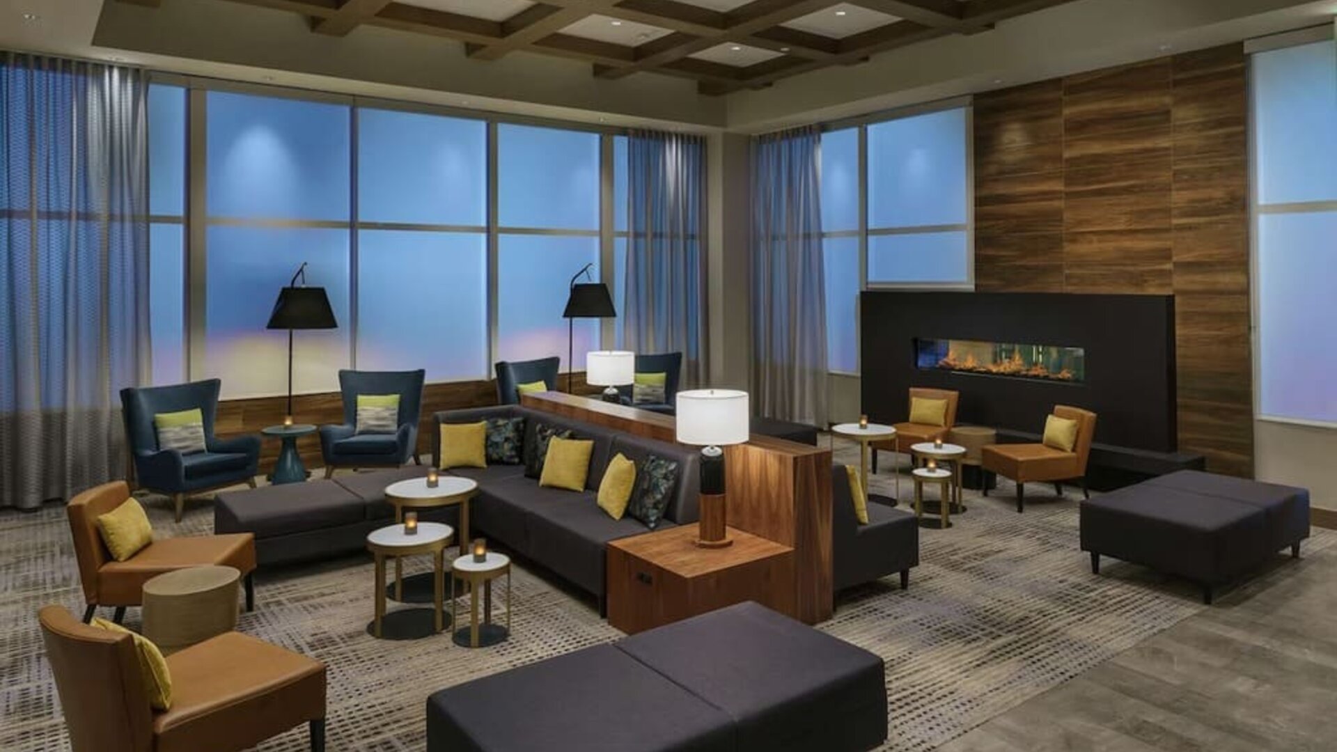 Lobby lounge with fireplace and workspace at Hilton Garden Inn Sunnyvale.