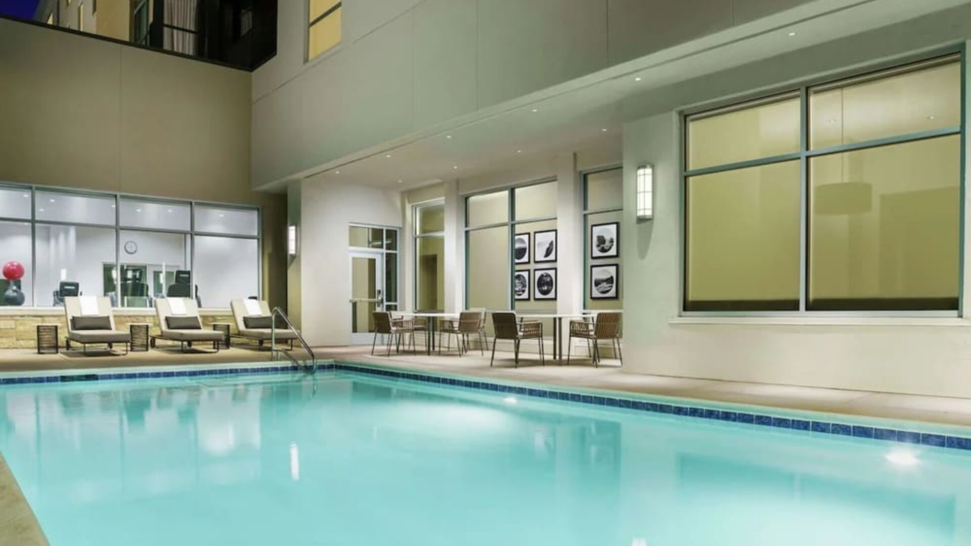 Outdoor pool with lounge chairs at Hilton Garden Inn Sunnyvale.