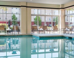 Relaxing indoor pool with lounge seating at DoubleTree By Hilton San Francisco Airport North Bayfront.