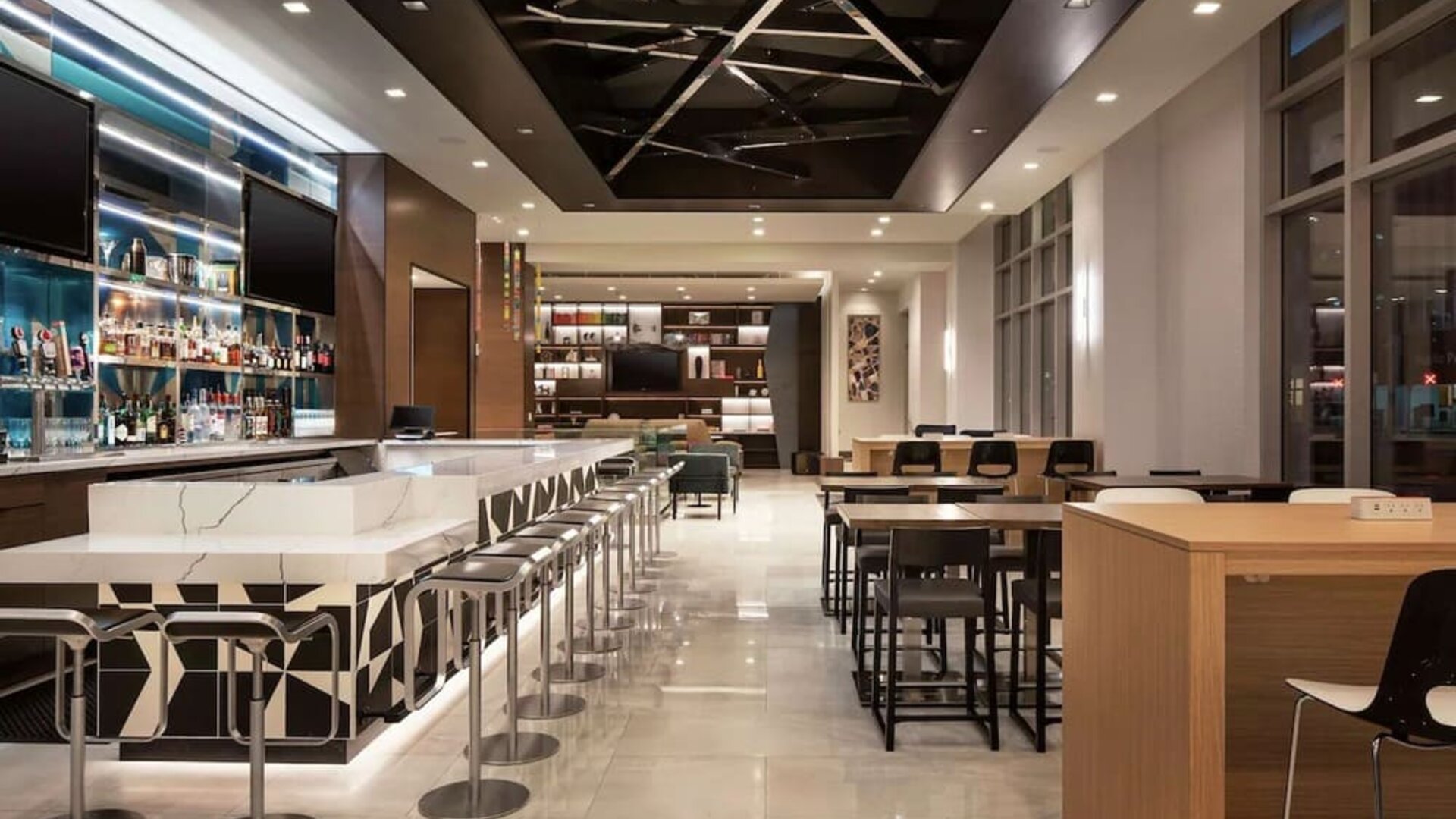 Hotel bar with lounge area perfect for coworking at Tru By Hilton Denver Downtown Convention Center.