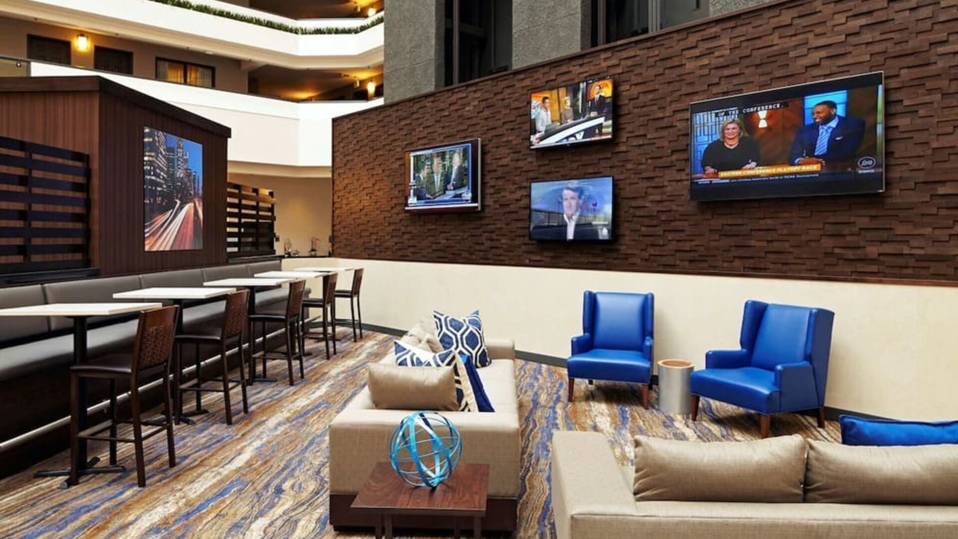 Lobby lounge and workspace at Embassy Suites By Hilton Los Angeles-Intl Airport North.