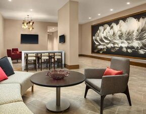 Lounge area and coworking space at Crowne Plaza Dallas Market Ctr - Love Field.