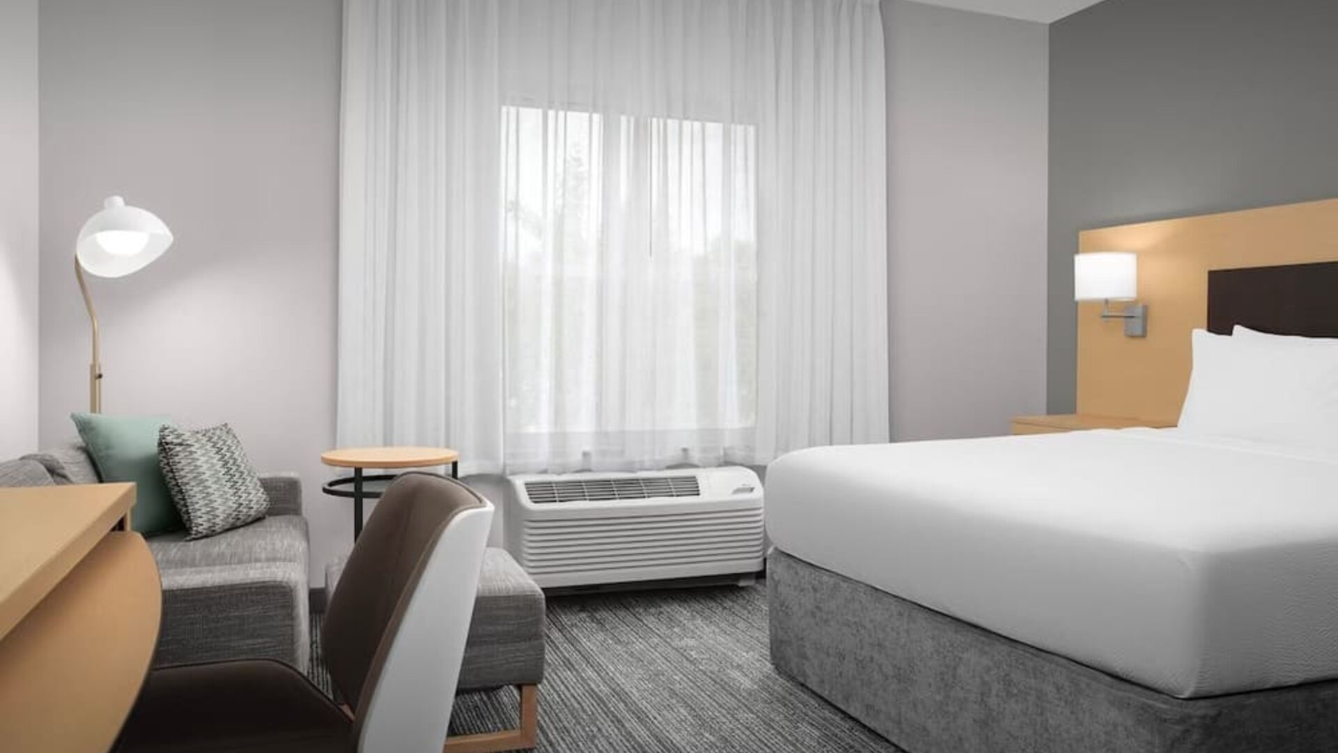 Day use room with sofa and work desk at TownePlace Suites Franklin Cool Springs.