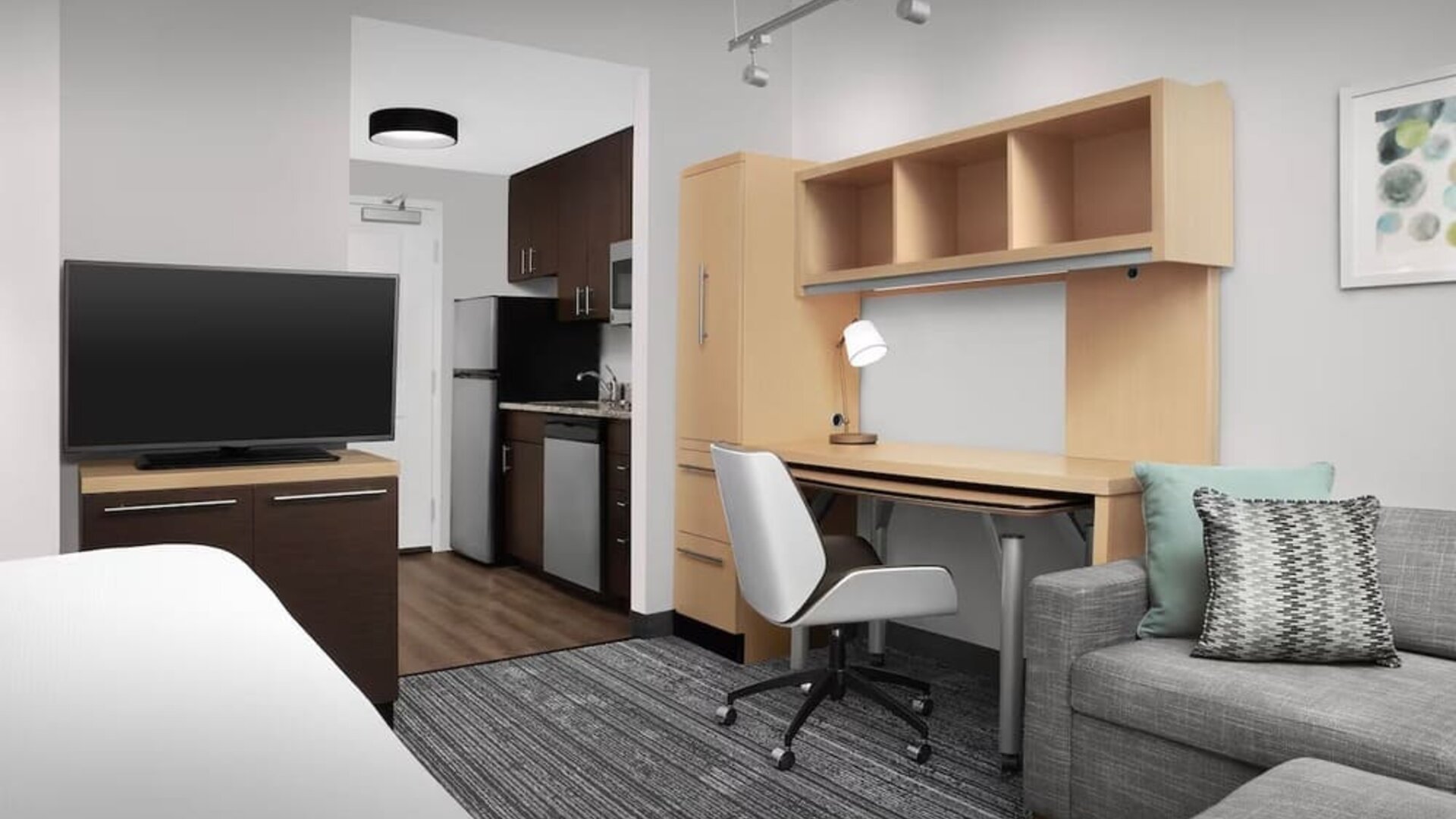 Day room amenities include TV, work desk, sofa, and in-room kitchen at TownePlace Suites Franklin Cool Springs.