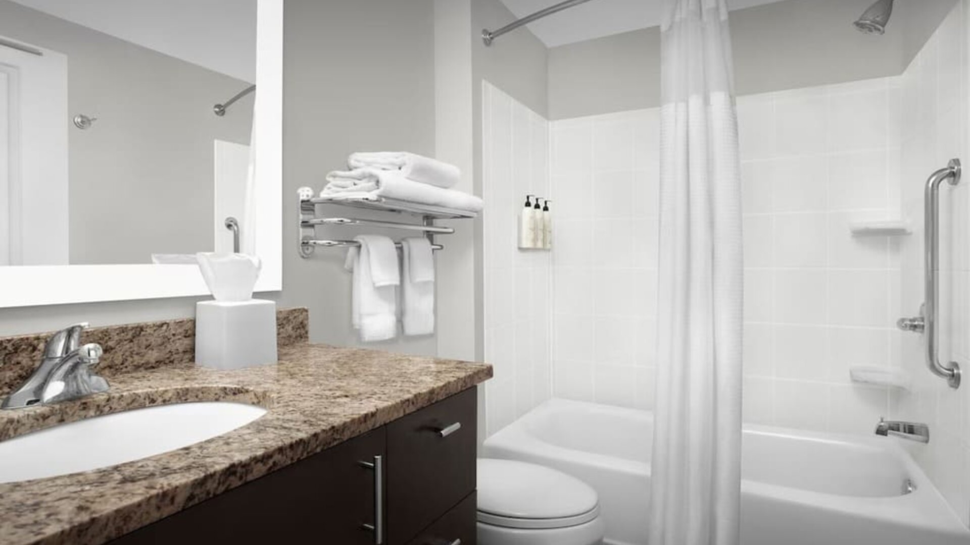 Guest bathroom with shower and tub at TownePlace Suites Franklin Cool Springs.
