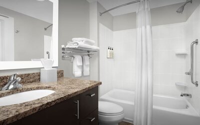 Guest bathroom with shower and tub at TownePlace Suites Franklin Cool Springs.