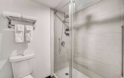 Private guest bathroom with shower at Radisson Hotel Schaumburg.