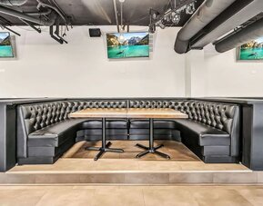 Dining area with comfortable seating at Radisson Hotel Schaumburg.