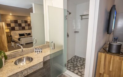 Private guest bathroom with shower and free toiletries at Catalina Hotel & Beach Club.