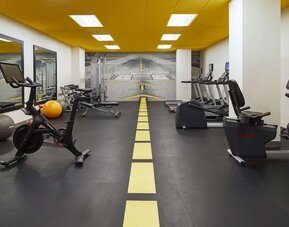 Fully equipped fitness center at H Hotel Los Angeles, Curio Collection By Hilton.