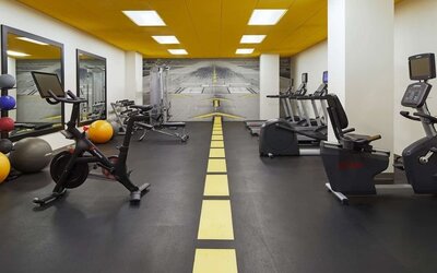 Fully equipped fitness center at H Hotel Los Angeles, Curio Collection By Hilton.