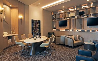 Business center with computers, printer and ergonomic seating at H Hotel Los Angeles, Curio Collection By Hilton.