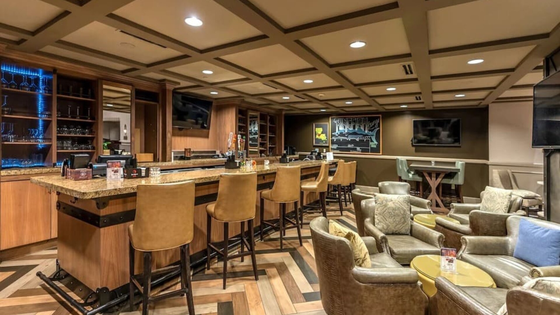 Dining area with lounge seating at Hilton Baton Rouge Capitol Center.