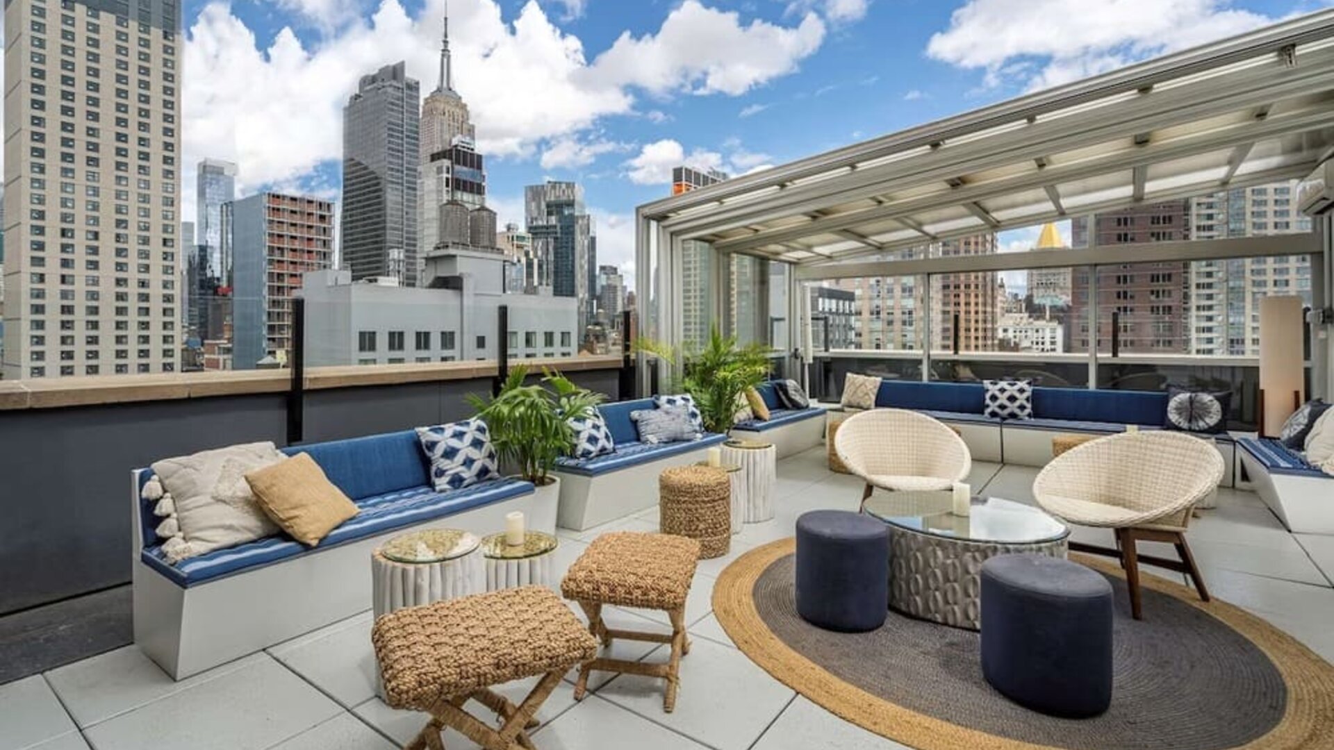 Rooftop coworking space with a view of the city at Hilton New York Fashion District.