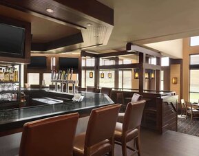 Hotel bar with lounge seating at DoubleTree By Hilton Hartford - Bradley Airport.