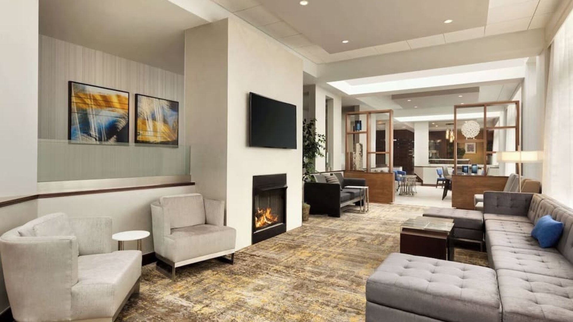 Lobby lounge area with fireplace at DoubleTree By Hilton Hartford - Bradley Airport.