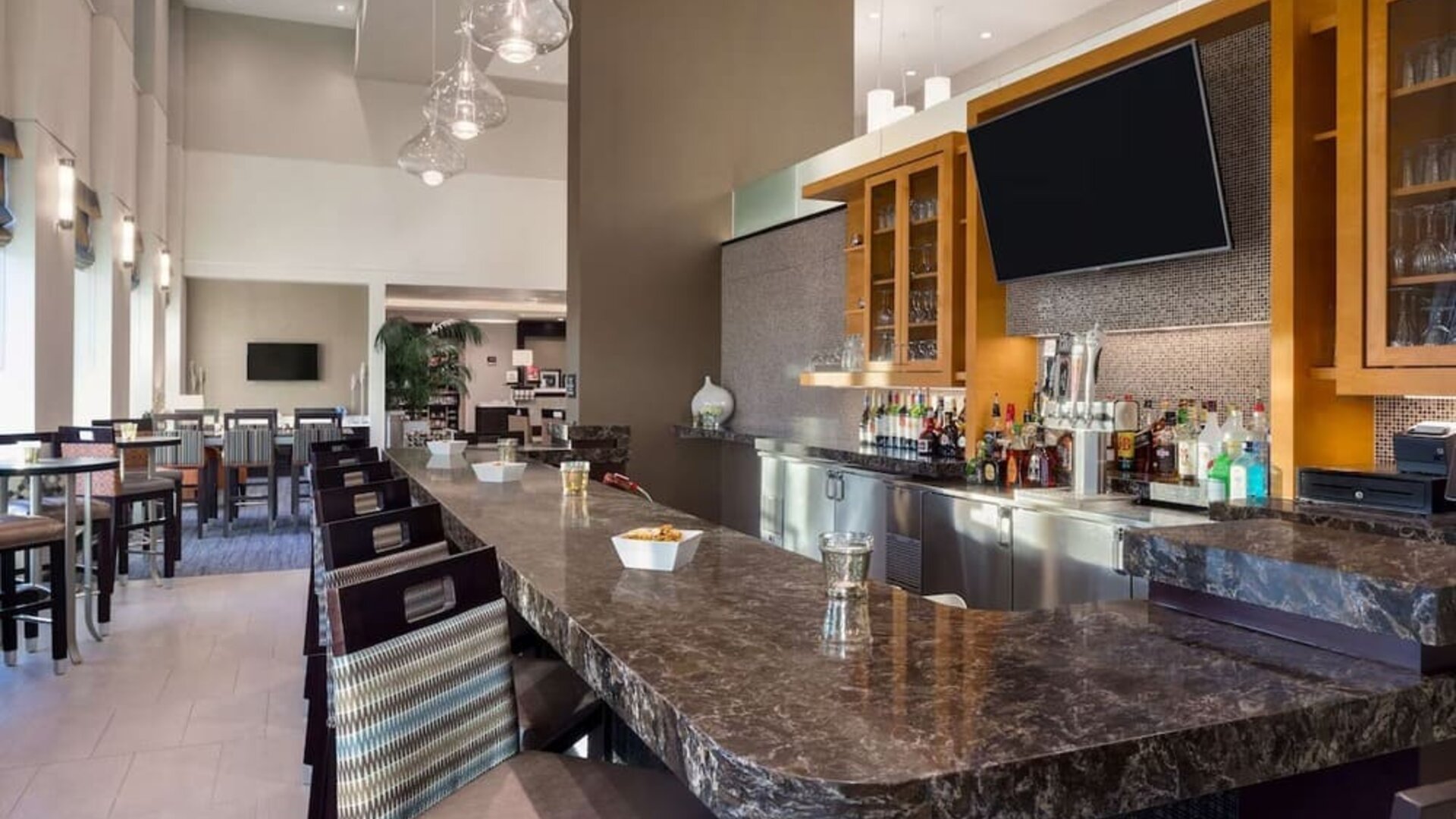 On-site bar at Hampton Inn & Suites Rosemont Chicago O'Hare.