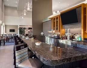 On-site bar at Hampton Inn & Suites Rosemont Chicago O'Hare.