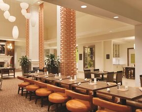 Dining area perfect for coworking at Hilton Garden Inn Boston Logan Airport.