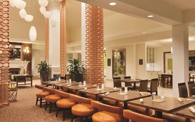 Dining area perfect for coworking at Hilton Garden Inn Boston Logan Airport.