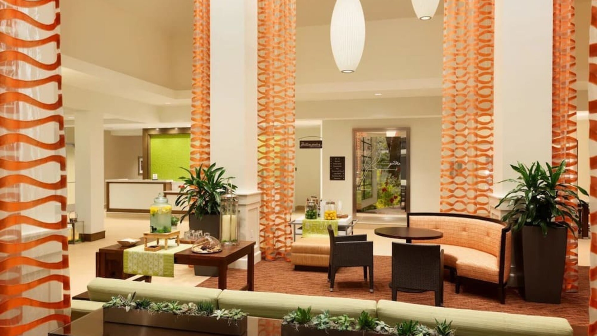 Lobby and coworking lounge at Hilton Garden Inn Boston Logan Airport.