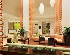 Lobby and coworking lounge at Hilton Garden Inn Boston Logan Airport.