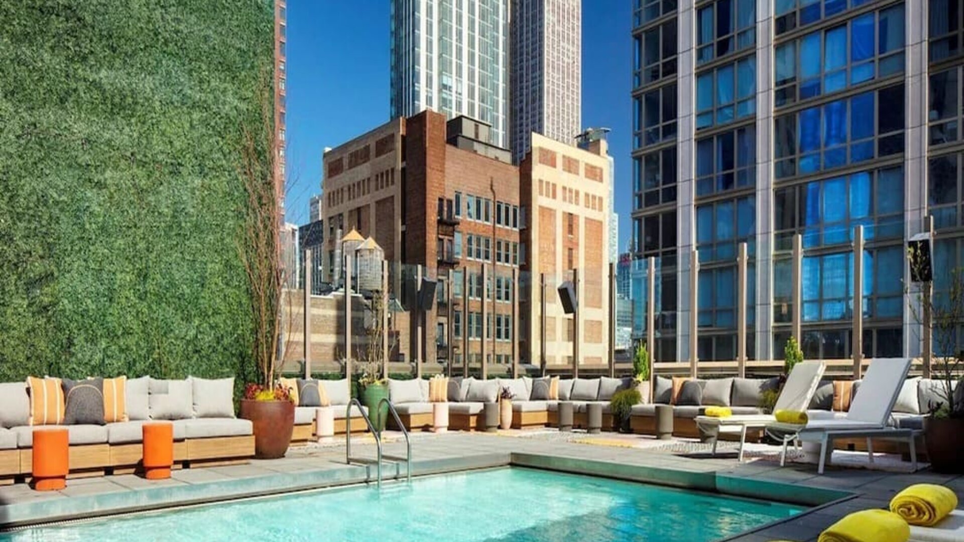 Stunning outdoor pool surrounded by skyscrapers at Royalton Park Avenue.