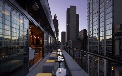 Hotel bar with balcony at Royalton Park Avenue.