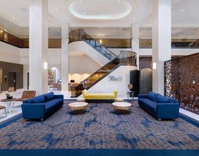 Lounge and coworking space at Embassy Suites By Hilton Santa Clara Silicon Valley.