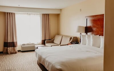 Delux king room with natural light at Comfort Inn Pomona Near Fairplex.