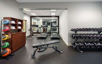 Fitness center at Homewood Suites By Hilton Miami Airport-Blue Lagoon.