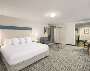 Spacious day use room with sofa and work desk at Homewood Suites By Hilton Miami Airport-Blue Lagoon.