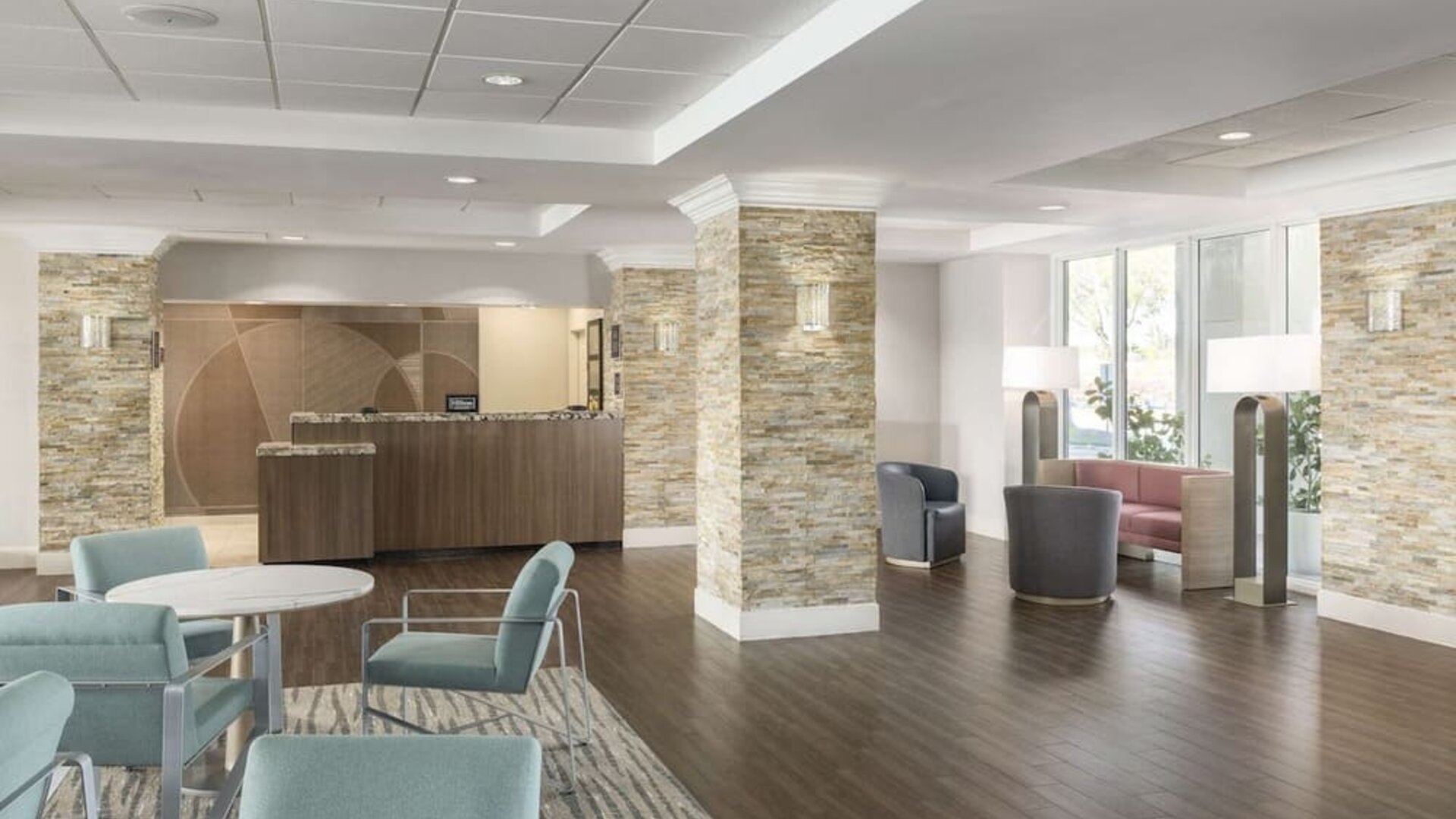 Lobby and coworking lounge at Homewood Suites By Hilton Miami Airport-Blue Lagoon.