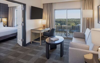 Day use room with living area and balcony at Hilton San Antonio Hill Country.