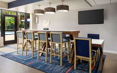 Lobby and coworking lounge at Hampton Inn Ft. Lauderdale-Cypress Creek.