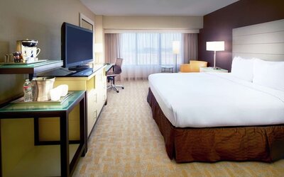 Day use room with work desk and natural light at Hilton Los Angeles Airport.
