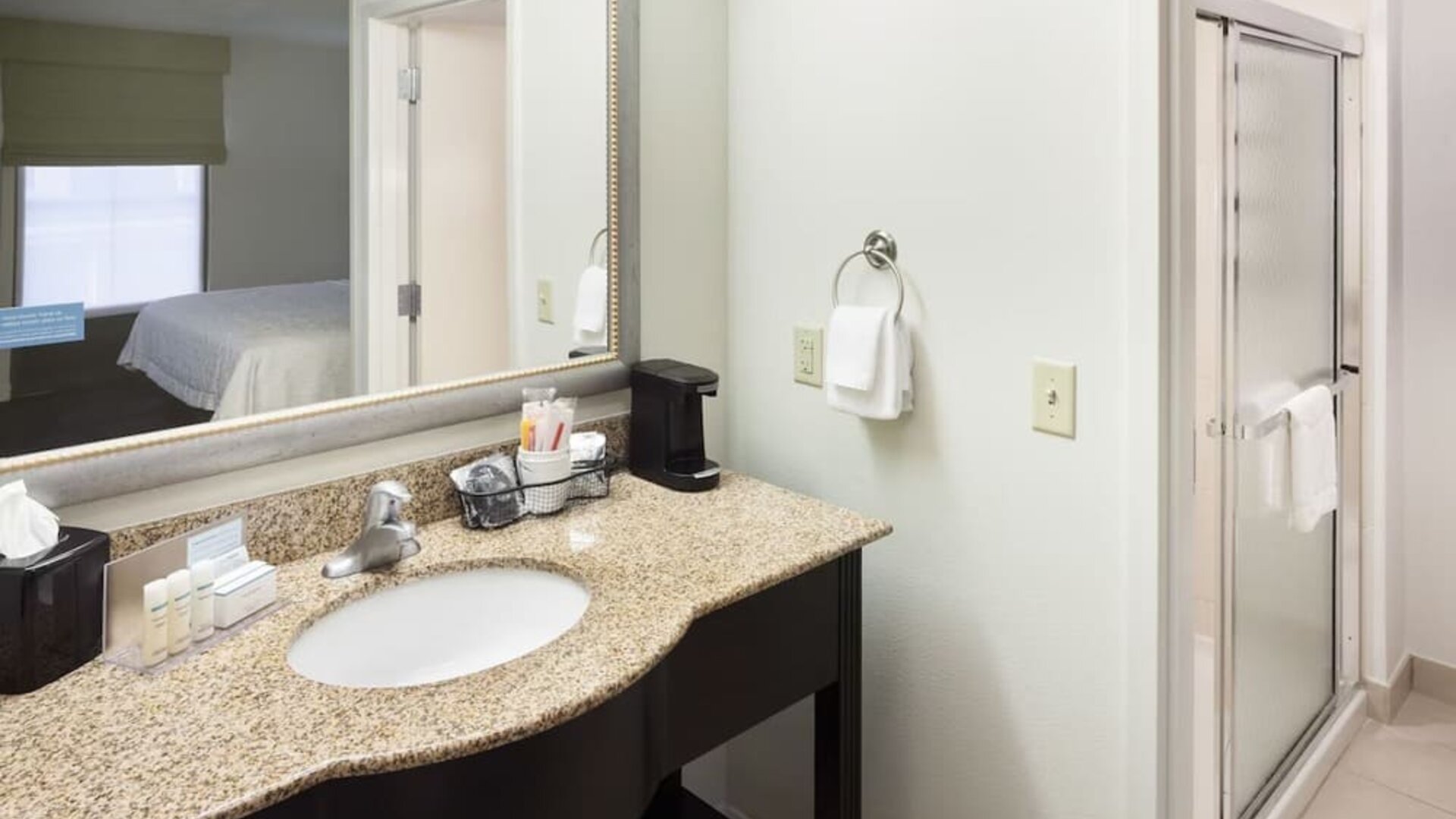 Private guest bathroom at Hampton Inn & Suites Gainesville-Downtown.