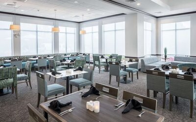 Dining area with comfortable seating, perfect for coworking at Hilton Garden Inn Dothan.