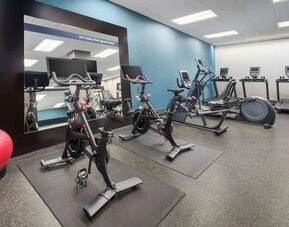 Fully equipped fitness center at Hampton Inn Manhattan/Times Square Central.