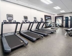 Fully equipped fitness center at Hampton Inn Manhattan/Times Square Central.
