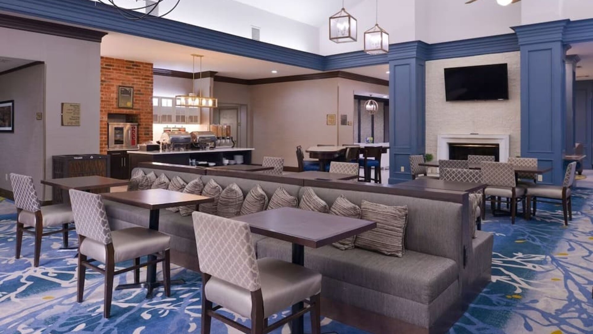 Dining area with comfortable seating, perfect for coworking at Homewood Suites By Hilton Dallas-Lewisville.