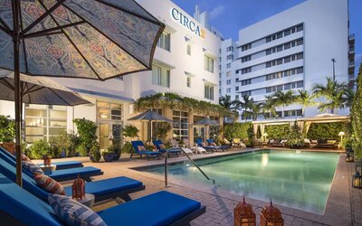 Outdoor pool with lounge seating at Circa 39 Hotel.