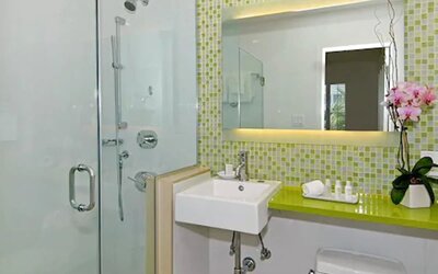Private guest bathroom with shower and free toiletries at Circa 39 Hotel.