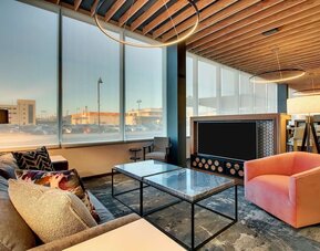 Lobby lounge area at The Rose Hotel Chicago O’Hare, Tapestry Collection By Hilton.