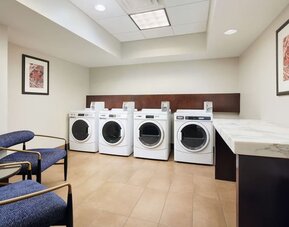 Laundry room available for guests at Embassy Suites By Hilton West Palm Beach Central.